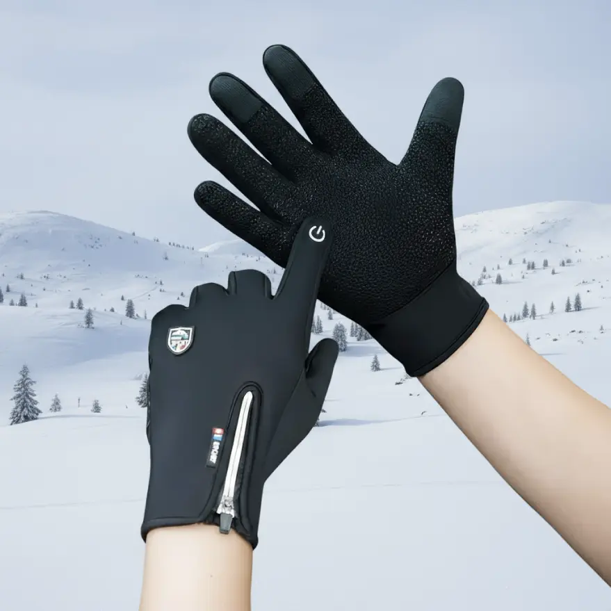 Hands in BooLex gloves in front of a snowy landscape